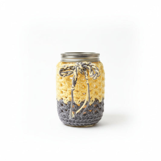 Yellow cotton table runner with two crocheted mason jar tea light candle holders