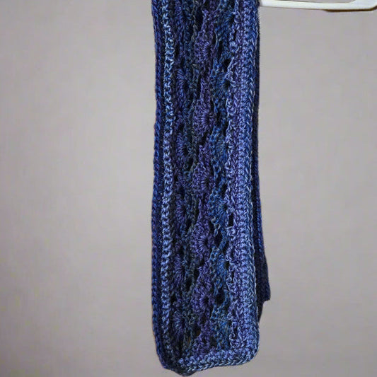 Decorative scarf in shades of blue with intricate knitted pattern, 62 inches long and 5.5 inches wide.
