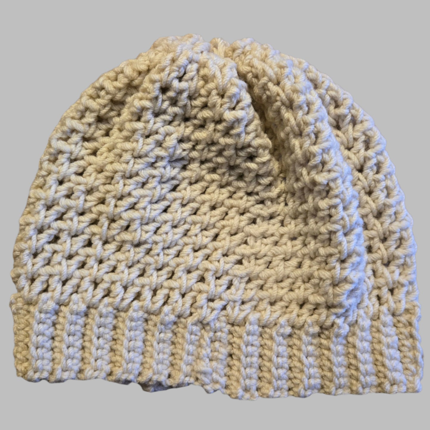 Handmade tan winter hat, 20-inch circumference, 9-inch height, soft and warm for winter.