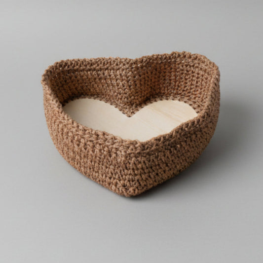 Handmade heart shape basket in brown macrame cord measuring 8x10 inches for rustic home decor and storage