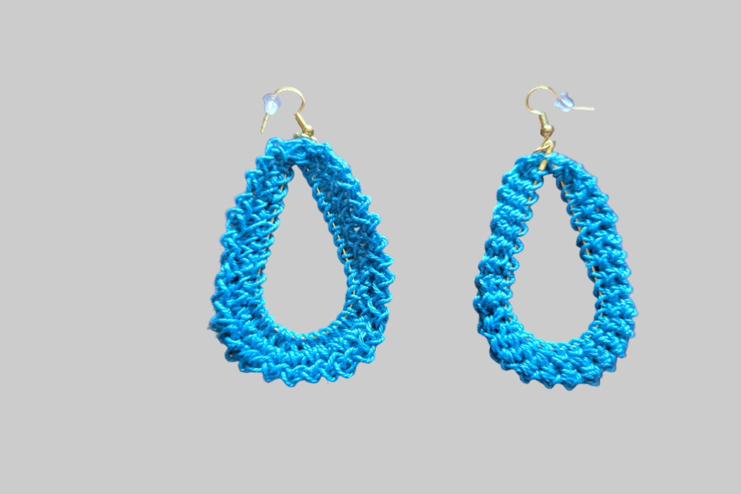 Teal hand crocheted pierced tear drop earrings.