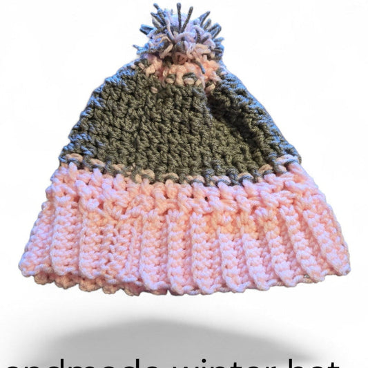 Handmade winter hat gray and pink in color with a pom pom