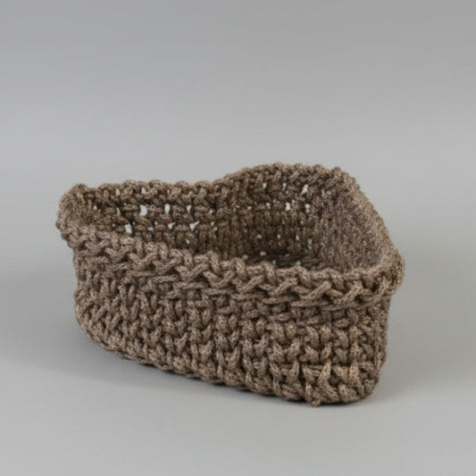 Handmade heart-shaped macrame basket in earth-tone polyester cord, artisan nesting storage organizer