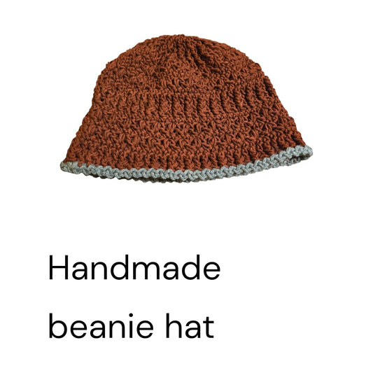 Handmade beane measures 8.5 inches tall and 22 inch circumference.