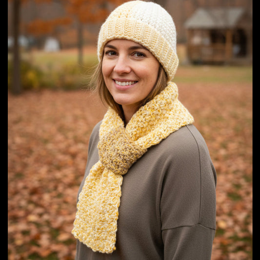 Handmade beanie and keyhole scarf in made with multi-colored yarn. Size large