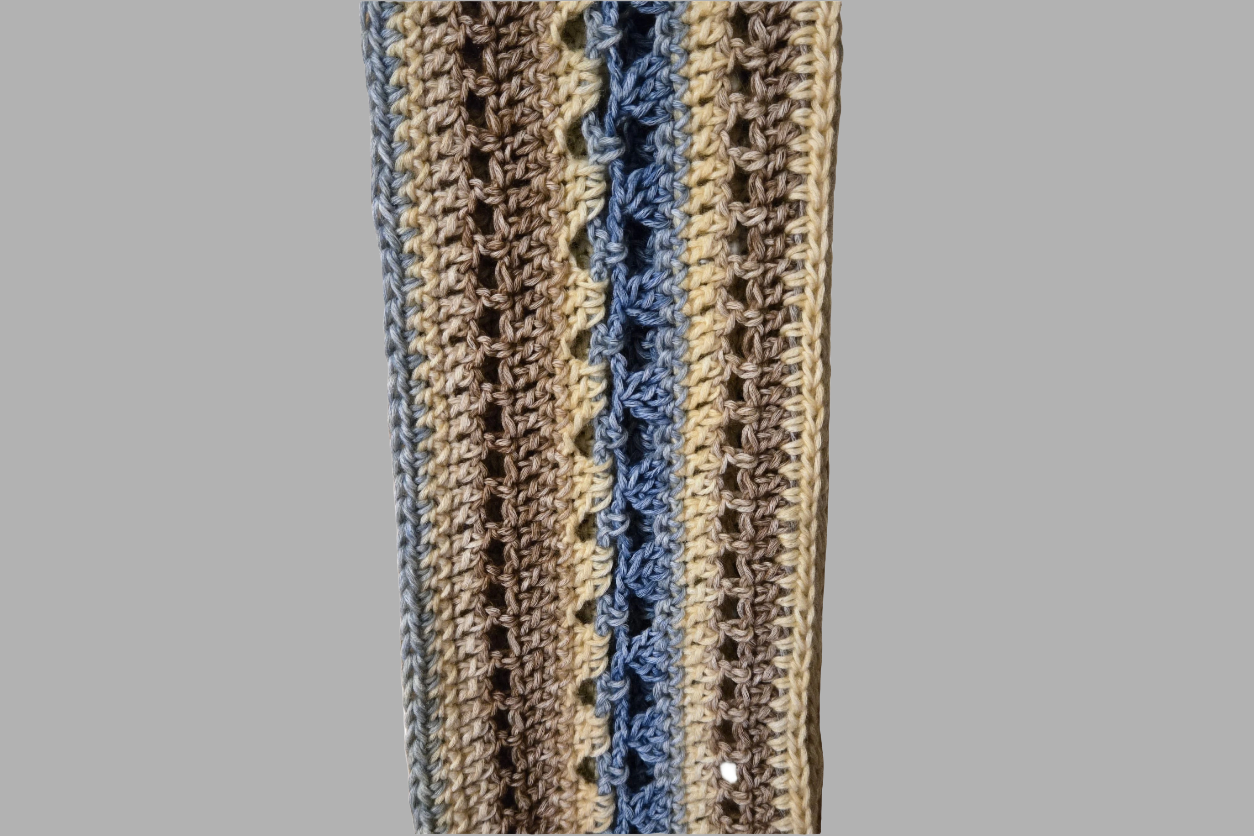 Handmade fashion scarf for women in multicolored browns and blues, lightweight and decorative wrap.