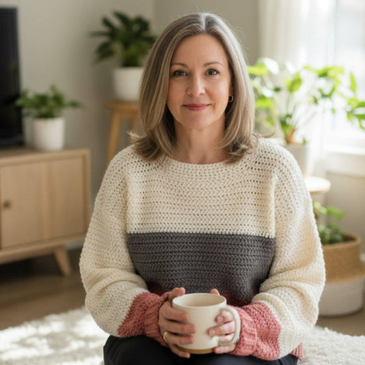 Pull over sweater cream, light gray and mauve in color