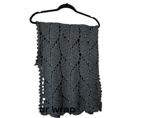 Handmade gray wrap with leaf pattern on hanger.