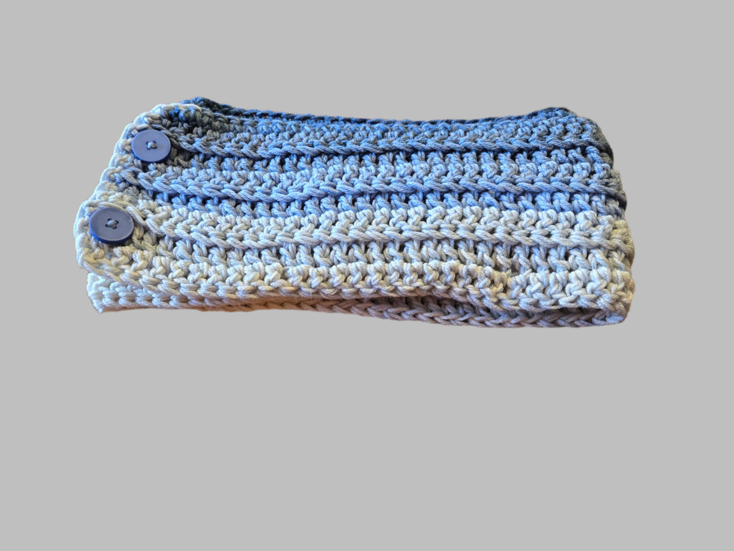 Handmade blue and cream winter headband with buttons, 4.5 inches wide.