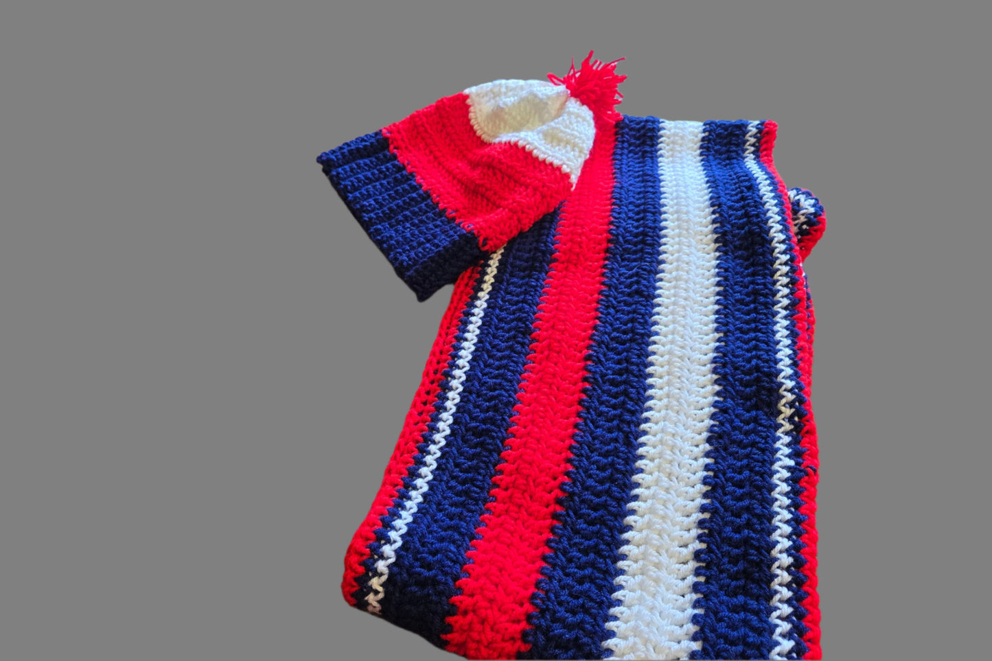 Red, white, and blue hat and scarf set for winter warmth.