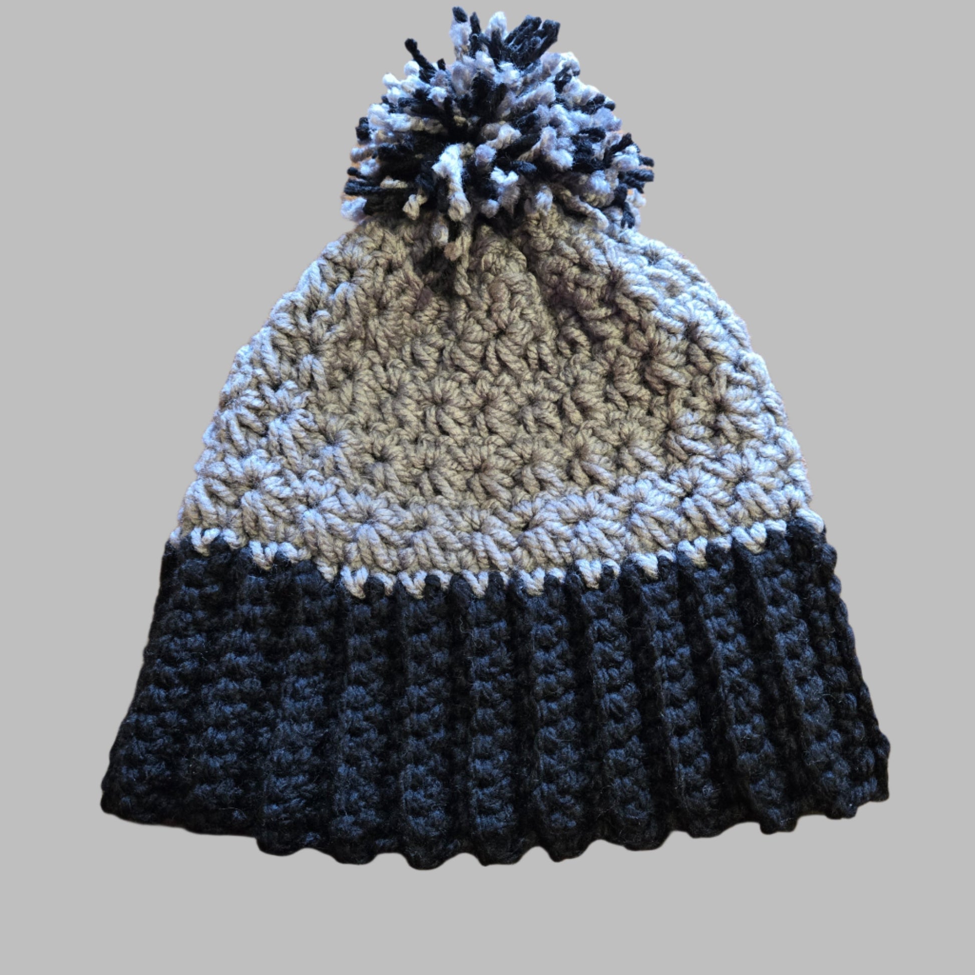 Crocheted gray and black winter hat with chunky yarn.