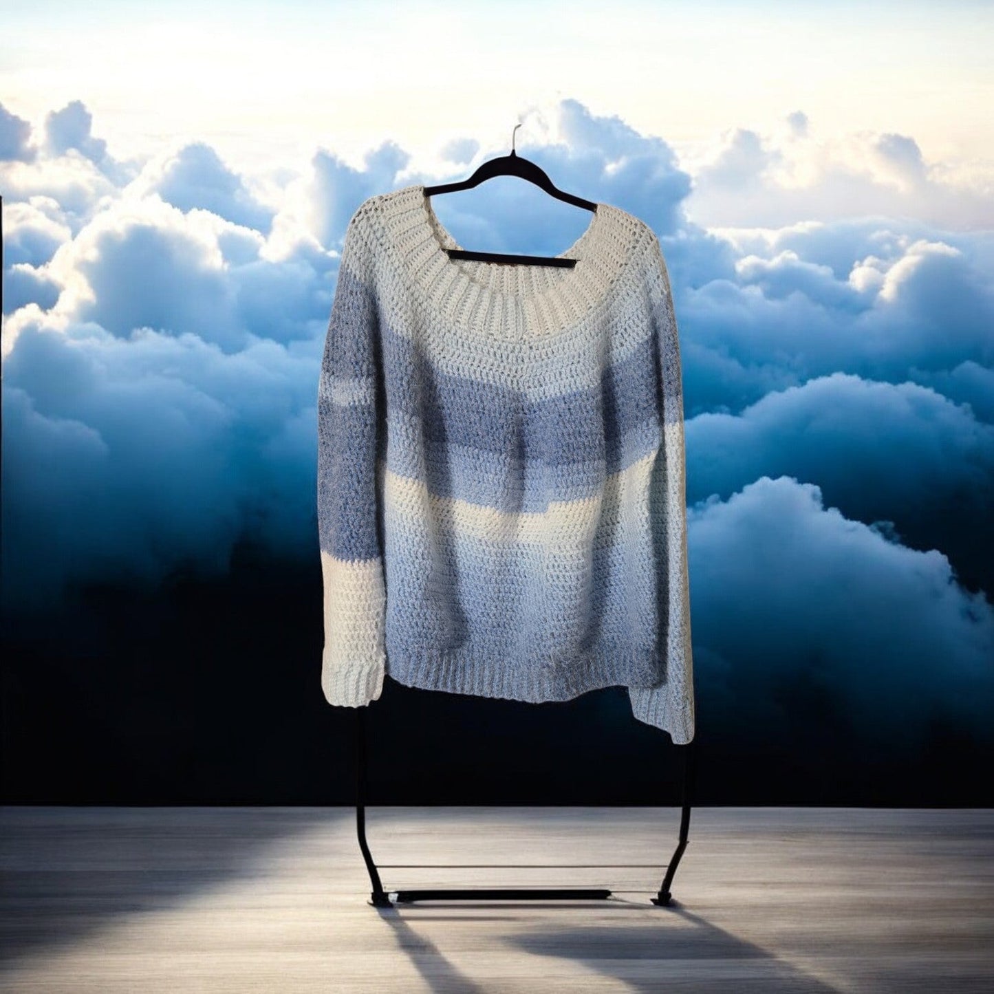 Handmade multi-blue pull-over sweater with long sleeves and soft yarn.