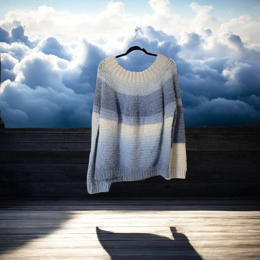 Handmade multi-colored blue pull-over sweater with long sleeves, soft yarn.