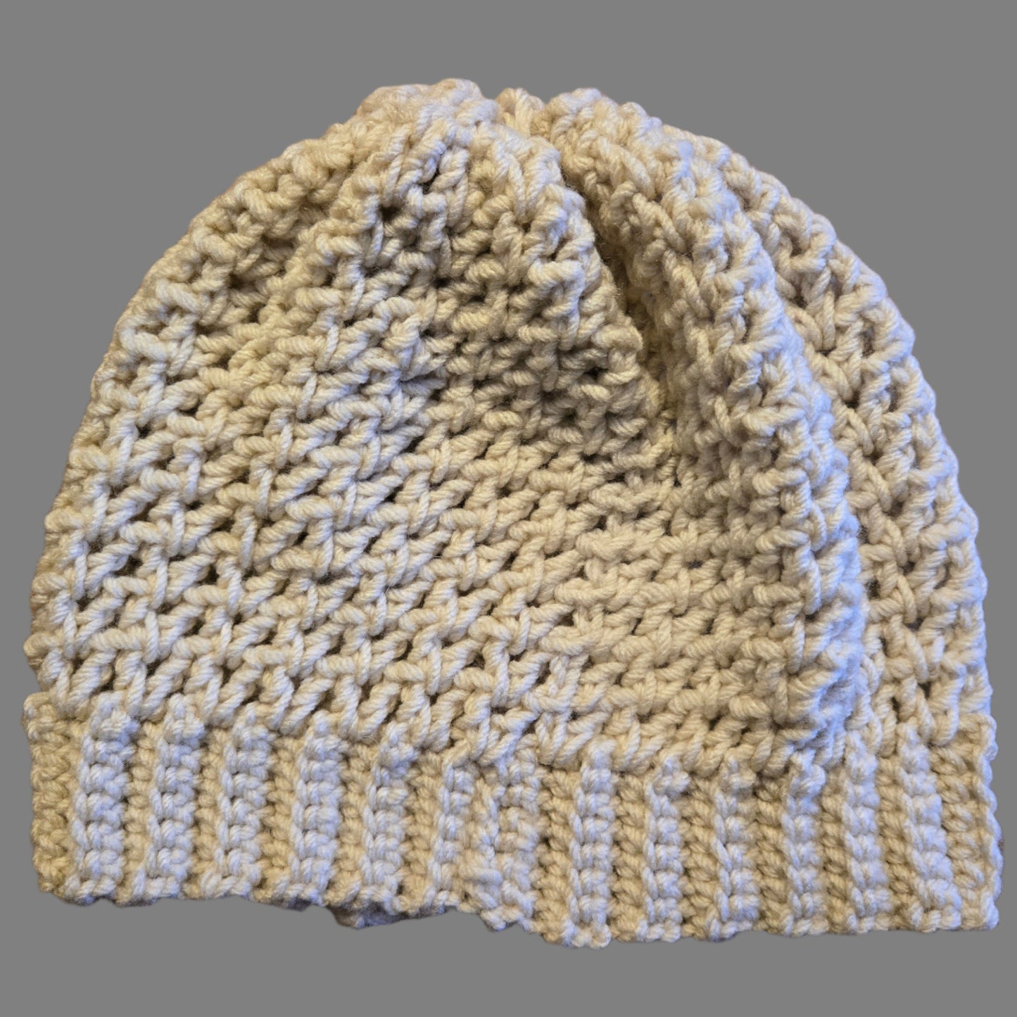 Handmade tan winter hat, 20-inch circumference, 9-inch height, soft and warm for winter.