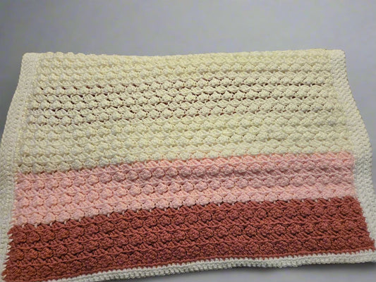 Handmade multicolored baby blanket with white border for crib and stroller use