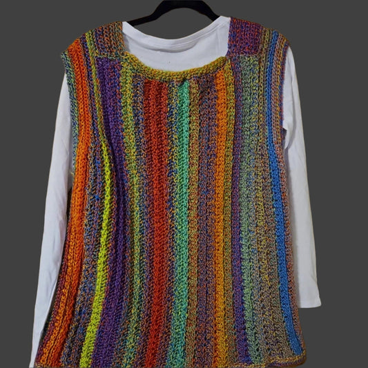 Multicolored vest with long sleeve white tee, perfect for stylish casual or dressy occasions.