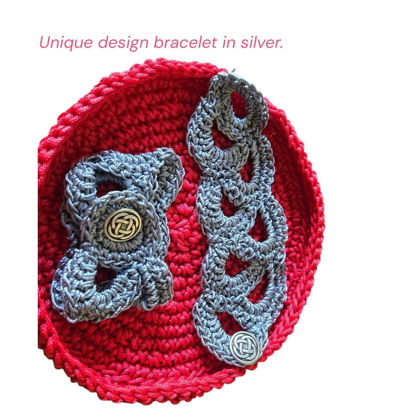 Crocheted vintage silver bracelets with button closures on red crocheted background