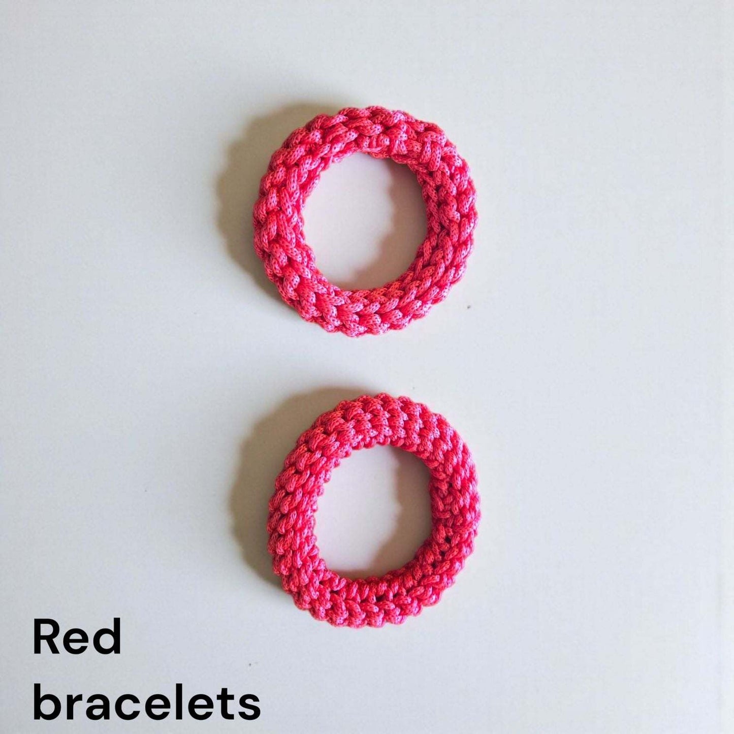 Handmade red bangle bracelets made from stretchable polyester cord