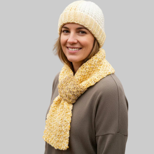 Handmade beanie and keyhole scarf in made with multi-colored yarn.   Size large