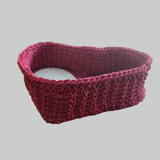 Handmade heart shaped basket in color maroon made from macrame cord.  Measures 8 x 10.