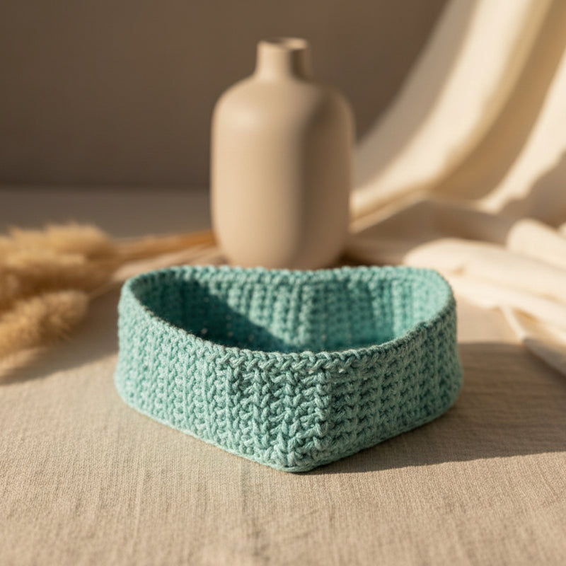 Handmade heart shaped basket made from macrame cord measures 8 x 12.