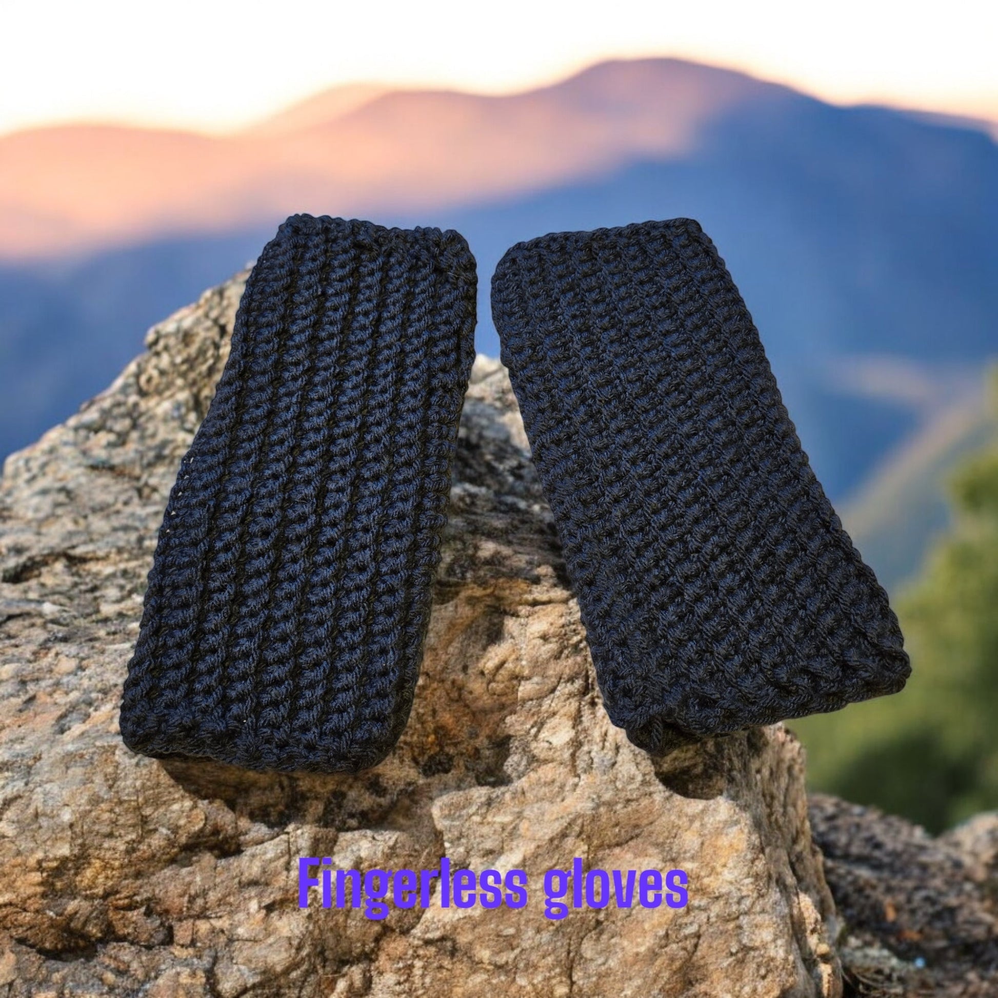 Dark blue fingerless gloves on a rock background, thick and stretchable material.