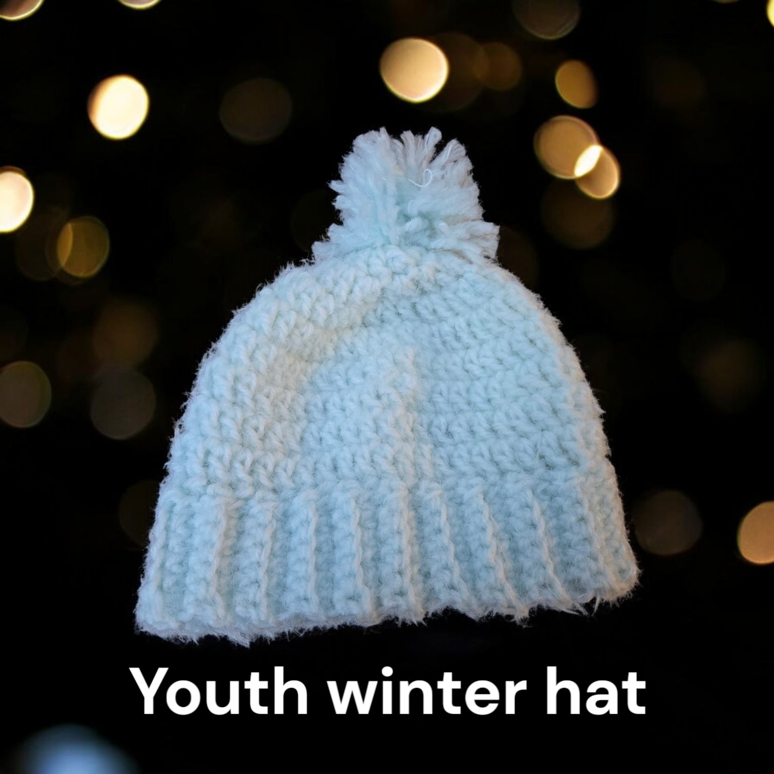 Mint green youth winter hat, handmade and cozy, with a 17-18 inch circumference.