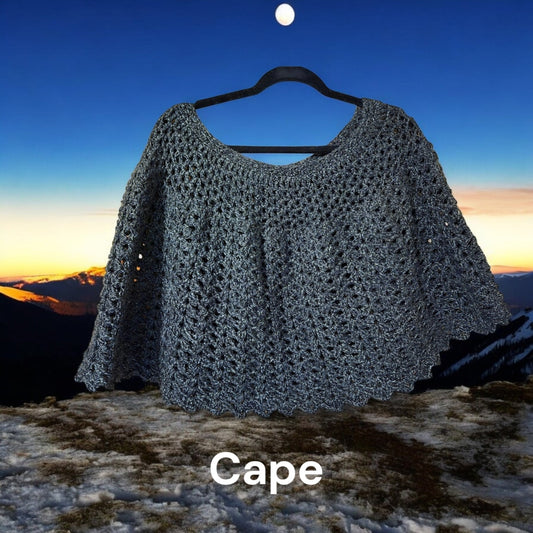 Handmade lightweight short cape for women against scenic background.