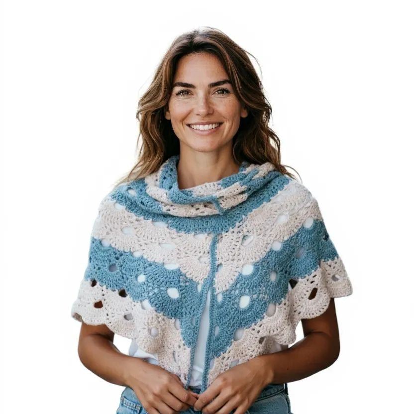 Woman wearing blue and white crocheted designer handmade shawl wrap made from cotton yarn