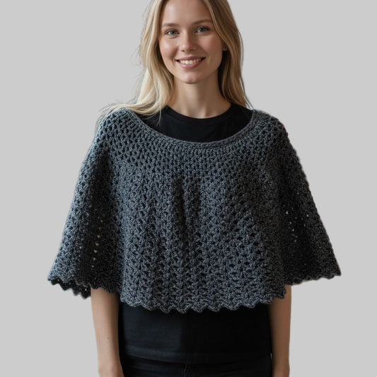 Short cape gray in color measures  16 inches in length and 38 inches wide at bottom.