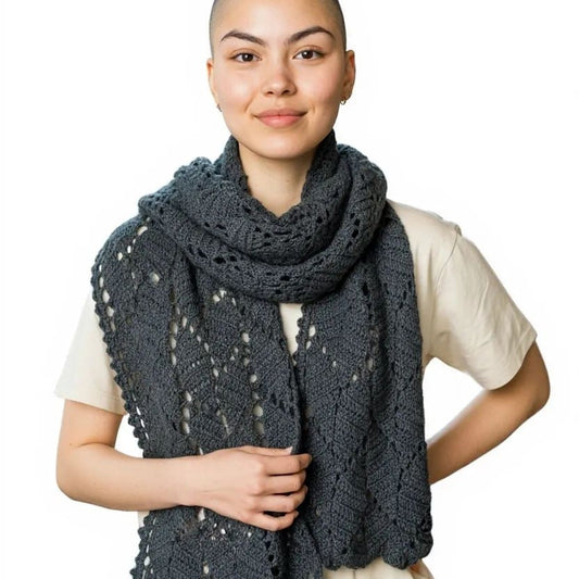 Gray scarf or wrap with a leaf pattern design.