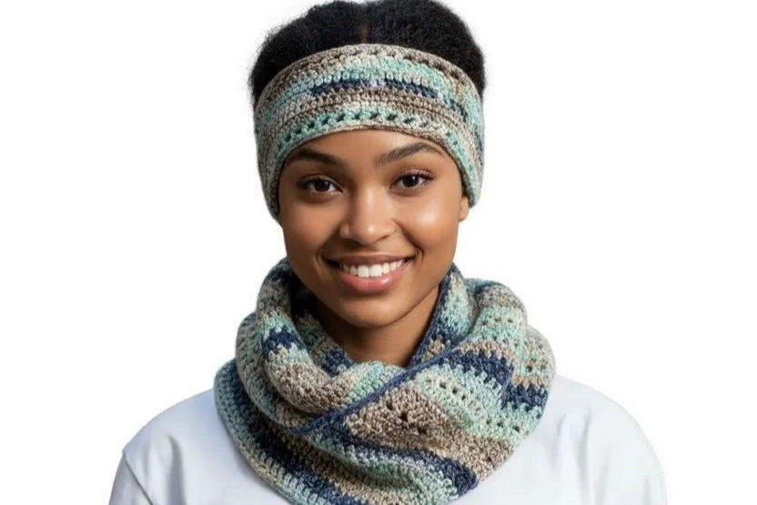 Person wearing a patterned headband and scarf on a white background