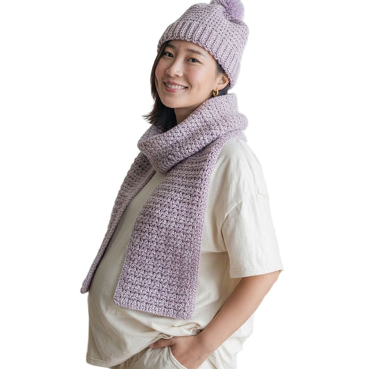 Handmade scarf in violet and hat with pom pom also violet in color.