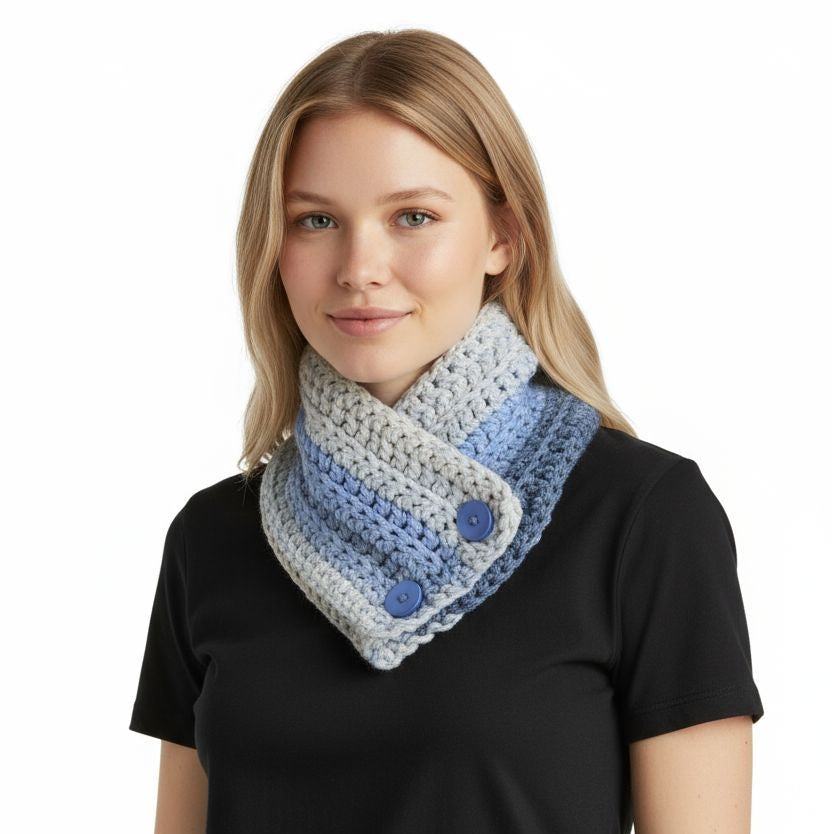 Woman wearing handmade chunky knit infinity scarf in blue and gray with button closure
