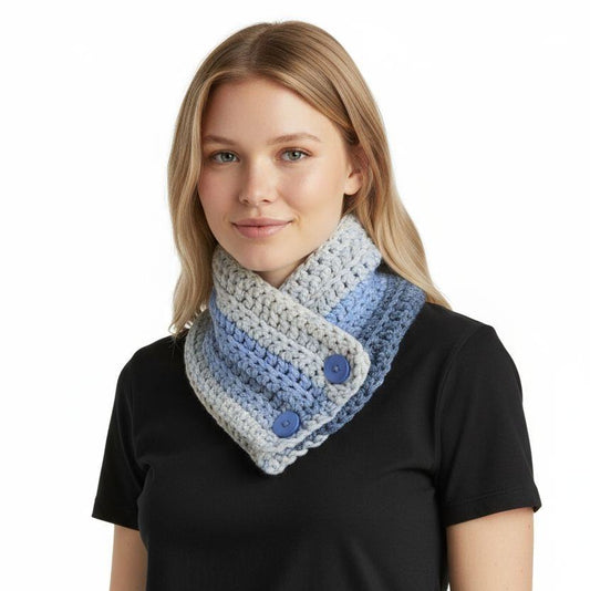 Woman wearing handmade chunky knit infinity scarf in blue and gray with button closure