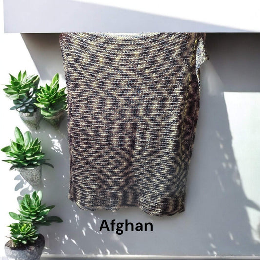 Handmade Afghan blanket in brown and white colors, 51 x 43 inches, perfect for warmth and cuddling.